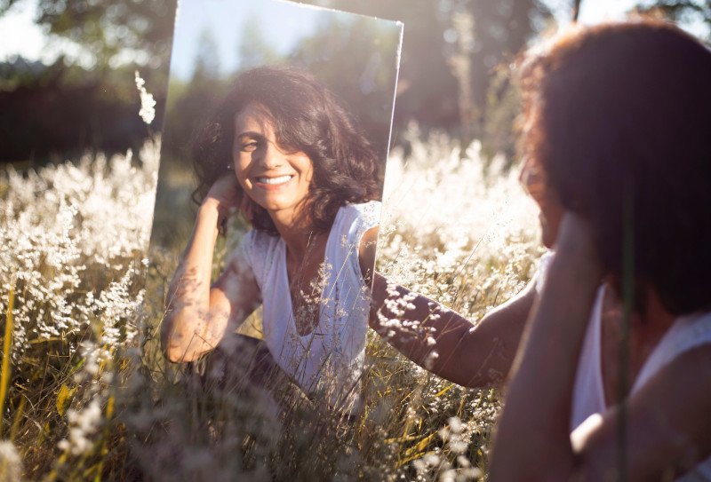 smiling at yourself improves your mood